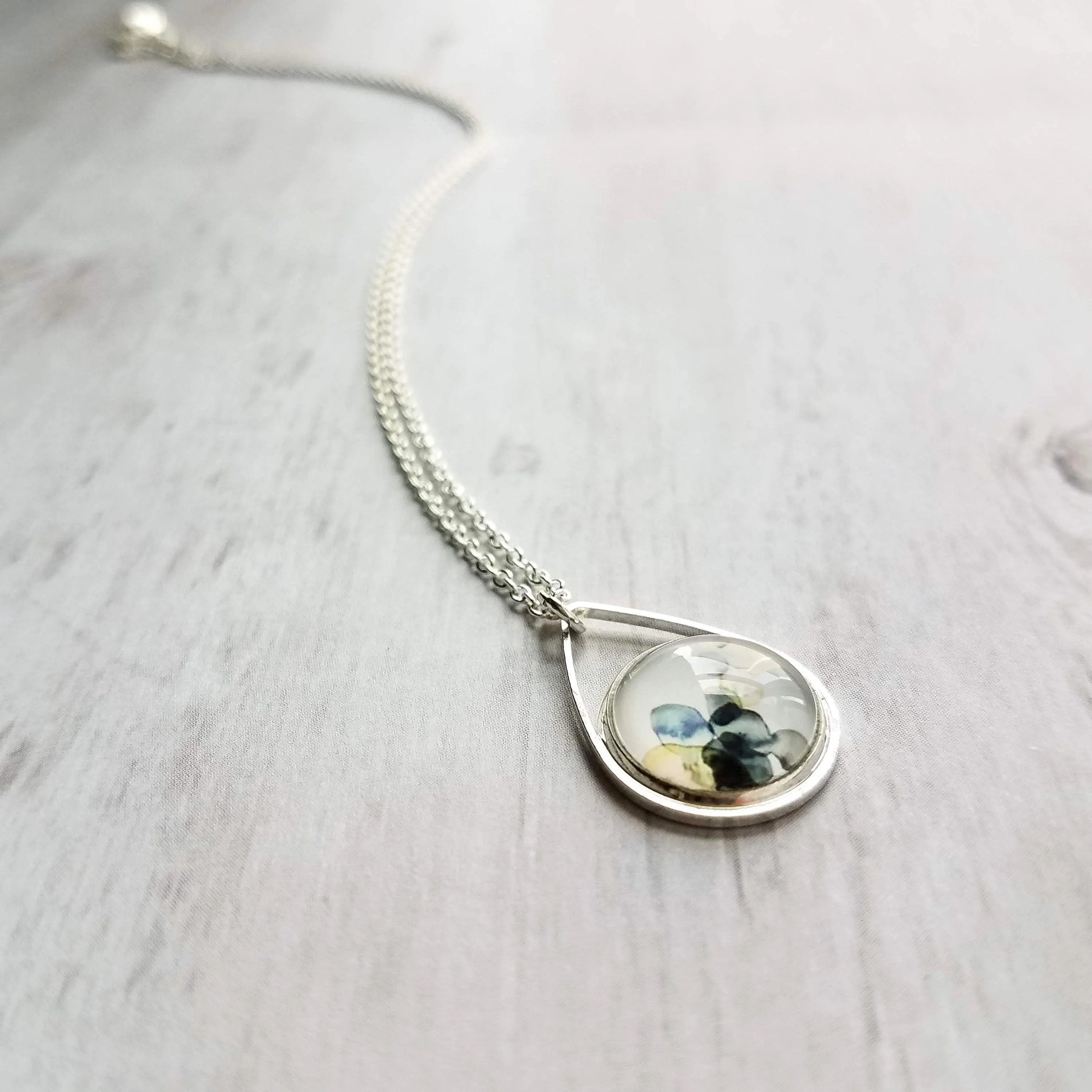 Watercolor Necklace, silver teardrop pendant, blue grey white yellow pendant, delicate silver chain, splotch teardrop pendant, alcohol ink style picture, art necklace